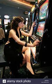 young girl gambling slot machine Stock Photo - Alamy